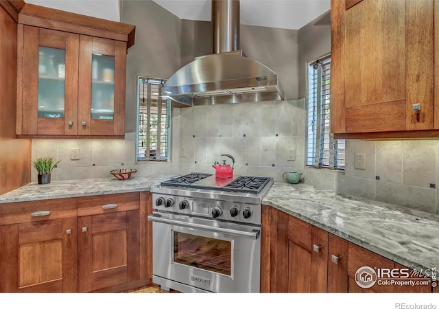 3345 15th St, Boulder, CO 80304 - kitchen with high end range, island range hood, and brown cabinetry