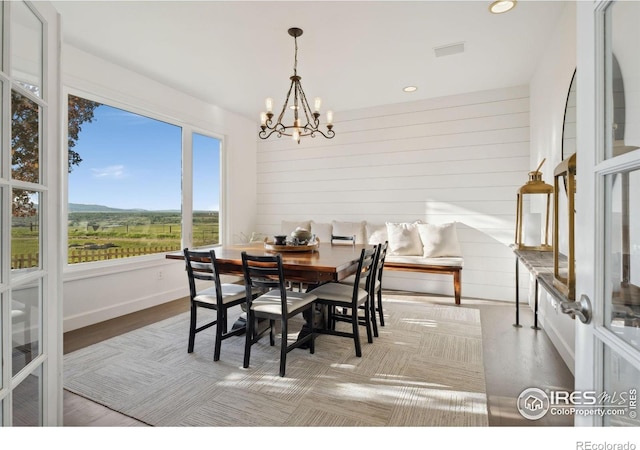 3401 E County Road 16, Loveland, CO 80537 - dining space with a chandelier, recessed lighting, wood finished floors, and a mountain view