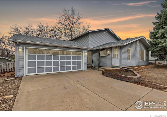 911 Timber Ct, Longmont, CO 80504 - view of front of house featuring concrete driveway and a garage