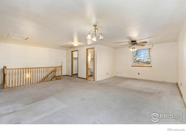 911 Timber Ct, Longmont, CO 80504 - carpeted empty room featuring a ceiling fan and a chandelier