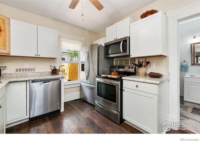 3730 Garfield Ave, Wellington, CO 80549 - kitchen featuring stainless steel appliances, white cabinets, ceiling fan, dark wood finished floors, and light stone counters
