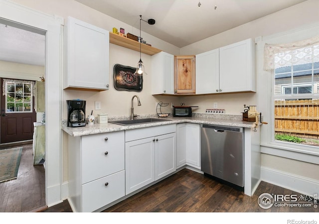 3730 Garfield Ave, Wellington, CO 80549 - kitchen featuring stainless steel dishwasher, dark wood-style floors, white cabinetry, and hanging light fixtures
