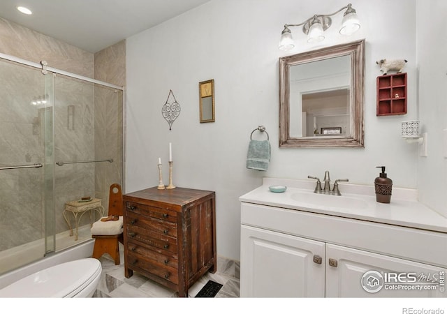 3730 Garfield Ave, Wellington, CO 80549 - bathroom featuring vanity, marble finish floors, and shower / bath combination with glass door