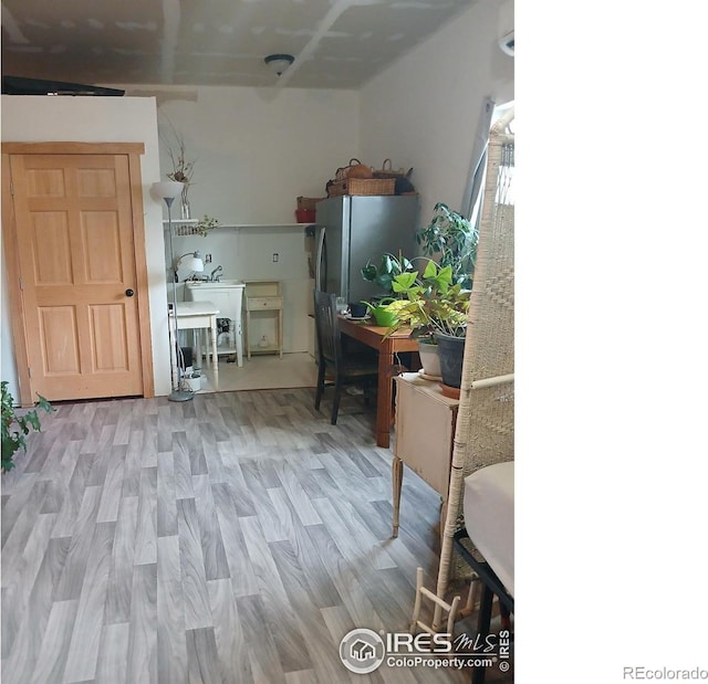 3730 Garfield Ave, Wellington, CO 80549 - kitchen featuring freestanding refrigerator and light wood-style flooring