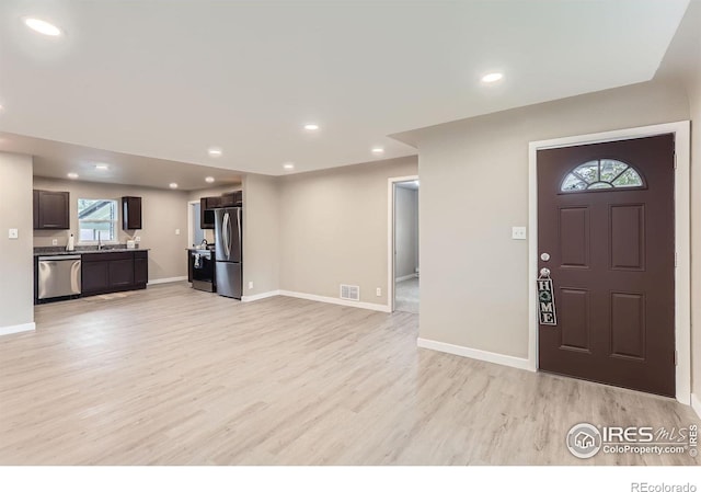 3014 High Dr, Evans, CO 80620 - foyer featuring light wood-type flooring, baseboards, and recessed lighting