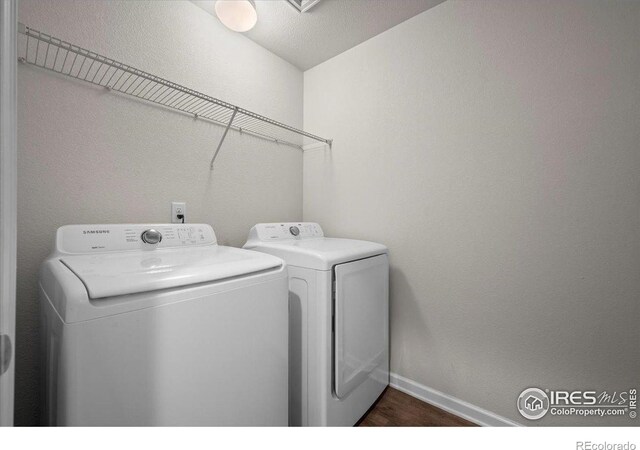 1426 Sepia Ave, Longmont, CO 80501 - washroom with washing machine and dryer, dark wood finished floors, and baseboards