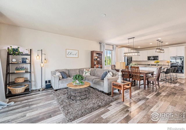 6253 Black Mesa Rd, Frederick, CO 80516 - living room with light wood finished floors and recessed lighting
