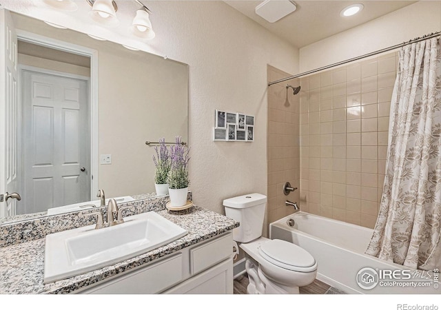 6253 Black Mesa Rd, Frederick, CO 80516 - bathroom featuring vanity, shower / tub combo, toilet, and a textured wall