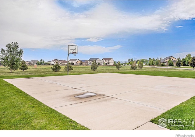 6253 Black Mesa Rd, Frederick, CO 80516 - view of basketball court with basketball hoop, a lawn, and a residential view