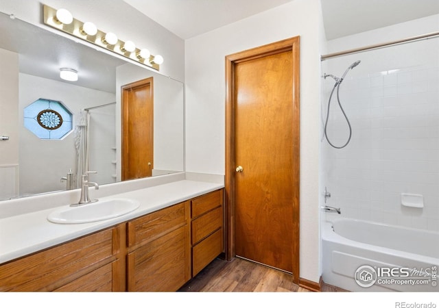 3500 Carlton Ave Unit 26, Fort Collins, CO 80525 - full bathroom with wood finished floors, vanity, and shower / bath combo with shower curtain