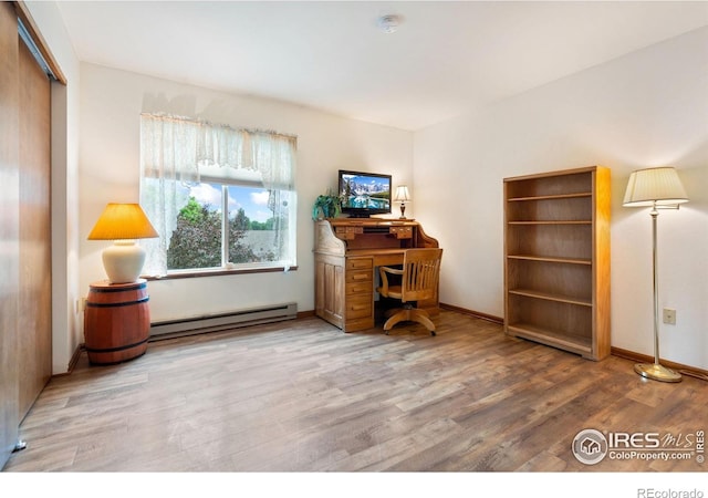 3500 Carlton Ave Unit 26, Fort Collins, CO 80525 - office space with baseboard heating, wood finished floors, and baseboards