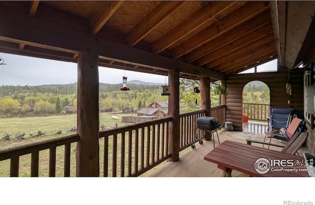 311 Chiricahua Cir, Red Feather Lakes, CO 80545 - wooden deck featuring a forest view, grilling area, and a yard