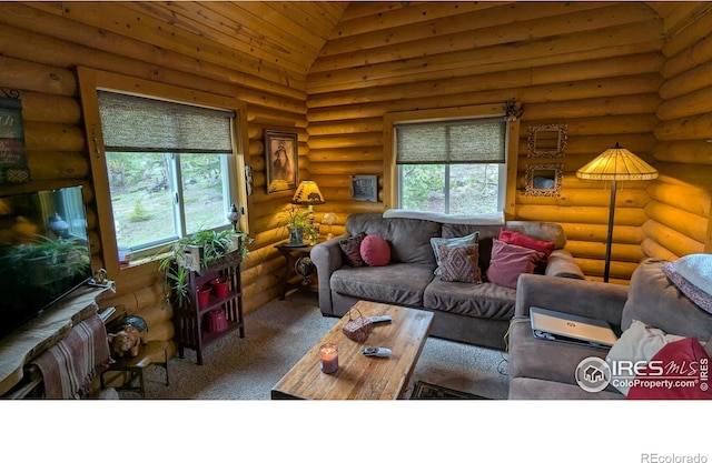 311 Chiricahua Cir, Red Feather Lakes, CO 80545 - living area featuring log walls, carpet flooring, and high vaulted ceiling