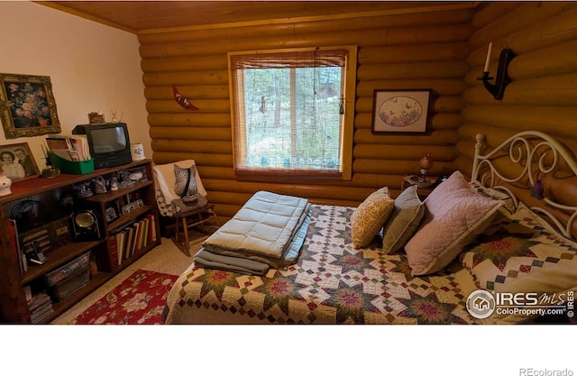 311 Chiricahua Cir, Red Feather Lakes, CO 80545 - bedroom featuring log walls
