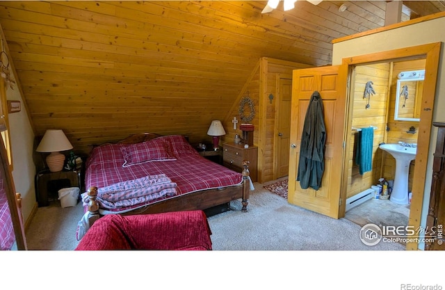 311 Chiricahua Cir, Red Feather Lakes, CO 80545 - bedroom with vaulted ceiling, carpet flooring, wooden ceiling, and a baseboard radiator