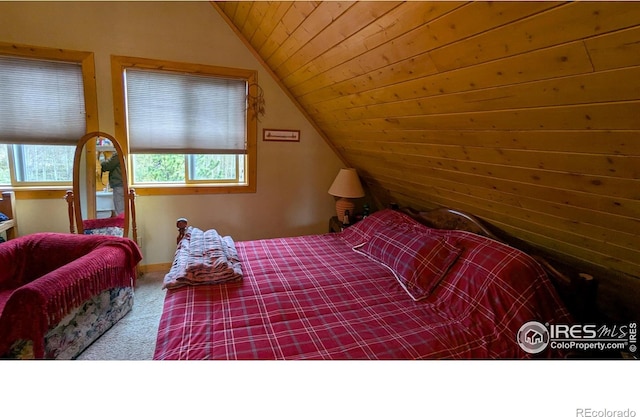 311 Chiricahua Cir, Red Feather Lakes, CO 80545 - bedroom featuring vaulted ceiling, carpet, wood ceiling, and baseboards