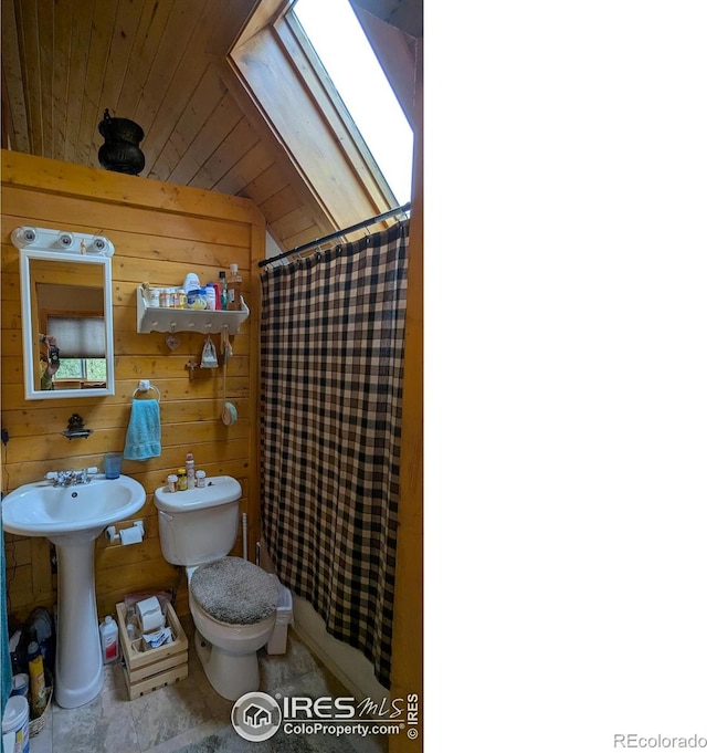 311 Chiricahua Cir, Red Feather Lakes, CO 80545 - bathroom featuring toilet, vaulted ceiling, a shower with curtain, wood walls, and wood ceiling