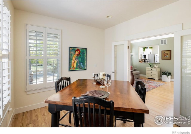 2758 Meadow Mountain Trl, Lafayette, CO 80026 - dining area featuring light wood-type flooring and baseboards