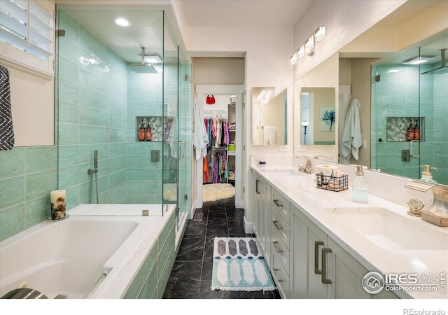 2758 Meadow Mountain Trl, Lafayette, CO 80026 - full bathroom with a shower stall, marble finish flooring, double vanity, a bath, and a spacious closet