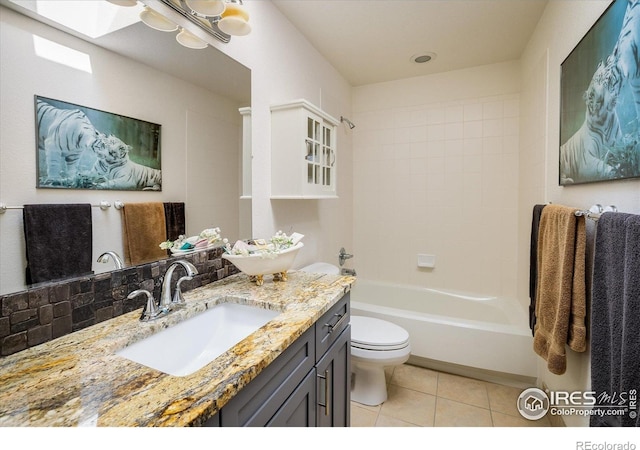 2758 Meadow Mountain Trl, Lafayette, CO 80026 - full bathroom featuring tile patterned flooring, vanity, toilet, bathtub / shower combination, and a skylight