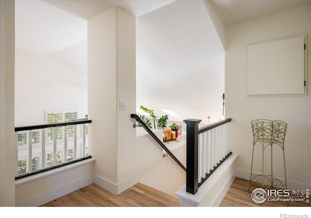 2758 Meadow Mountain Trl, Lafayette, CO 80026 - stairway featuring wood finished floors and baseboards