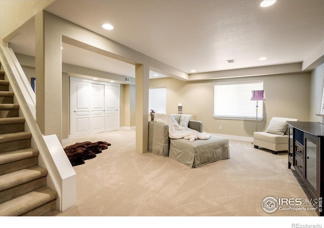 2758 Meadow Mountain Trl, Lafayette, CO 80026 - living area with light colored carpet, recessed lighting, stairs, and baseboards