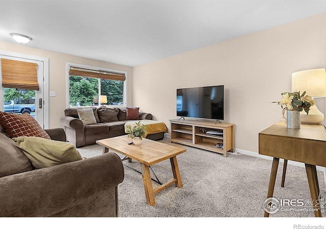 437 Fox St, Longmont, CO 80504 - carpeted living area featuring baseboards