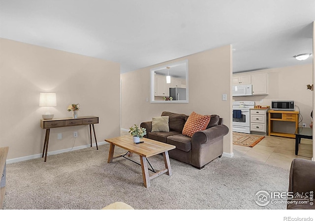 437 Fox St, Longmont, CO 80504 - living room with light colored carpet and baseboards