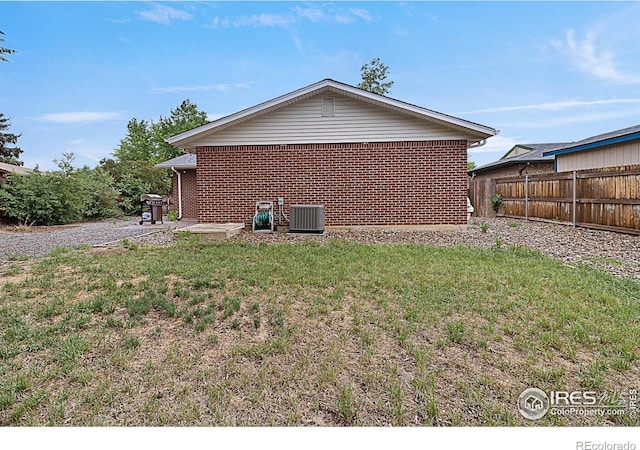 437 Fox St, Longmont, CO 80504 - view of home's exterior with central AC and brick siding