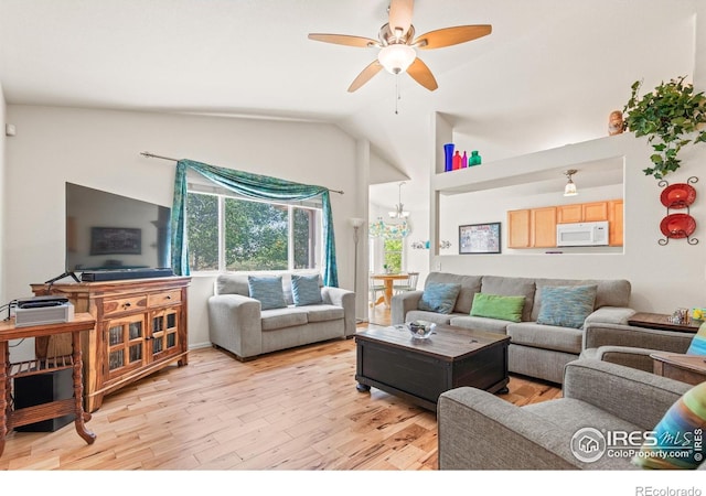8734 19th Street Rd, Greeley, CO 80634 - living area with light wood-style floors, a ceiling fan, and vaulted ceiling