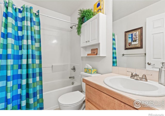 8734 19th Street Rd, Greeley, CO 80634 - full bathroom featuring shower / bathtub combination with curtain, toilet, and vanity
