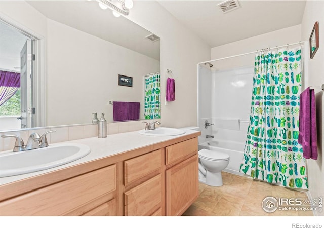 8734 19th Street Rd, Greeley, CO 80634 - full bathroom with double vanity, toilet, and shower / bath combo