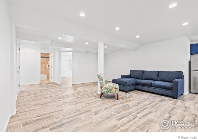 8734 19th Street Rd, Greeley, CO 80634 - living room with light wood finished floors, recessed lighting, and baseboards