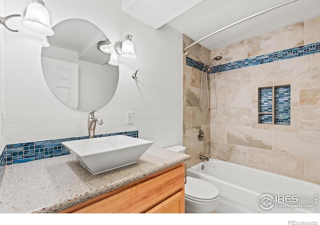 8734 19th Street Rd, Greeley, CO 80634 - bathroom featuring shower / bathtub combination, vanity, and toilet