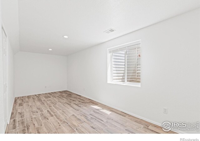 8734 19th Street Rd, Greeley, CO 80634 - spare room featuring light wood-style floors, recessed lighting, and baseboards