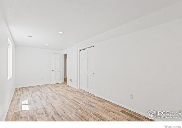 8734 19th Street Rd, Greeley, CO 80634 - spare room with light wood-type flooring, recessed lighting, and baseboards