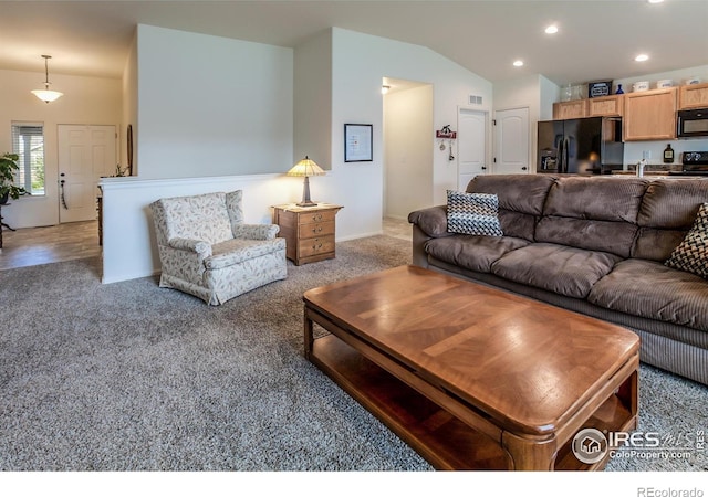 944 Maplebrook Dr, Windsor, CO 80550 - living room featuring lofted ceiling, carpet floors, and recessed lighting