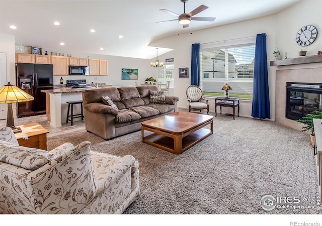 944 Maplebrook Dr, Windsor, CO 80550 - living area featuring recessed lighting, a ceiling fan, a chandelier, a fireplace, and light carpet