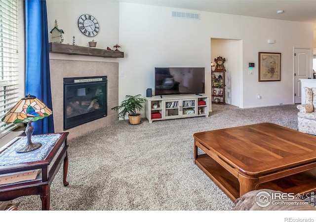 944 Maplebrook Dr, Windsor, CO 80550 - living room featuring carpet and a tile fireplace