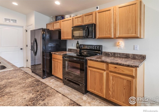 944 Maplebrook Dr, Windsor, CO 80550 - kitchen featuring black appliances, dark countertops, and recessed lighting