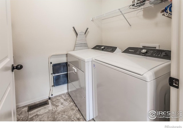 944 Maplebrook Dr, Windsor, CO 80550 - laundry area with washing machine and clothes dryer and baseboards