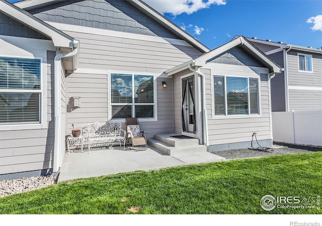 944 Maplebrook Dr, Windsor, CO 80550 - rear view of property with a patio area
