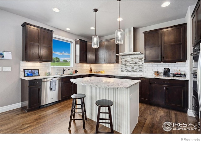 7427 Couples Ct, Fort Collins, CO 80528 - kitchen featuring dishwasher, wall chimney range hood, dark wood finished floors, dark brown cabinetry, and recessed lighting