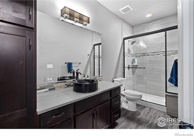 7427 Couples Ct, Fort Collins, CO 80528 - bathroom with toilet, vanity, and a shower stall