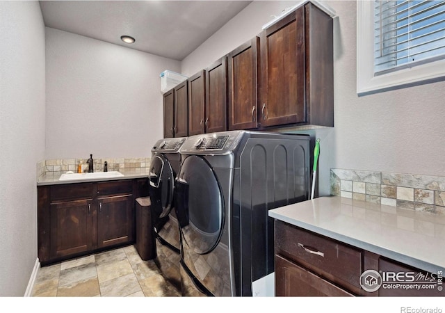 7427 Couples Ct, Fort Collins, CO 80528 - laundry room featuring cabinet space, independent washer and dryer, and baseboards