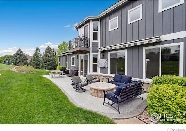 7427 Couples Ct, Fort Collins, CO 80528 - back of property featuring board and batten siding, a balcony, a lawn, a patio, and an outdoor living space with a fire pit