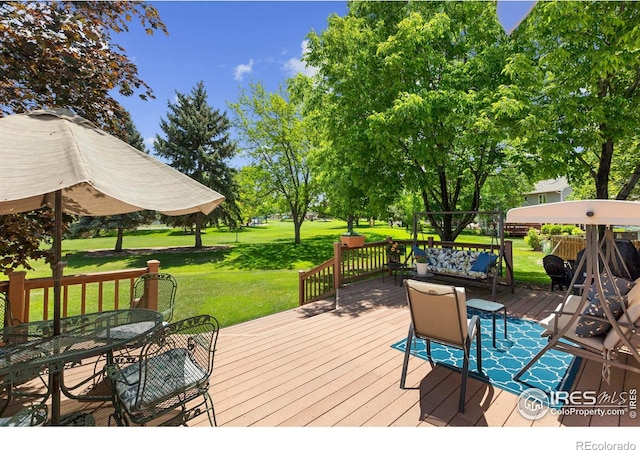 3804 Amy Pl, Loveland, CO 80538 - wooden terrace with a yard and outdoor dining area