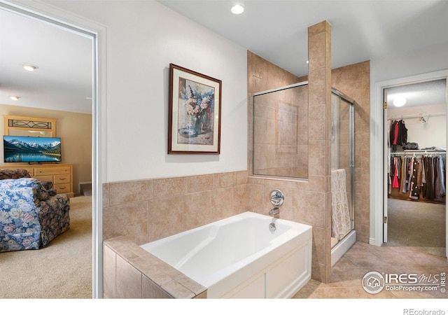 3804 Amy Pl, Loveland, CO 80538 - bathroom featuring a garden tub, a shower stall, a walk in closet, and recessed lighting