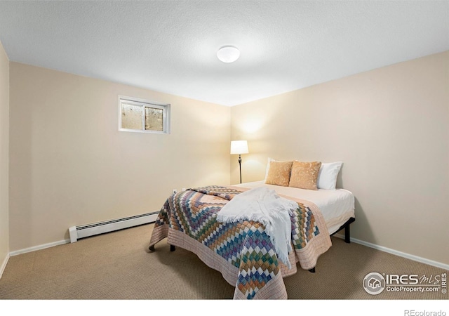 3804 Amy Pl, Loveland, CO 80538 - bedroom featuring a baseboard radiator, carpet, and baseboards
