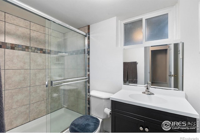 3804 Amy Pl, Loveland, CO 80538 - full bathroom with vanity, a shower stall, and toilet